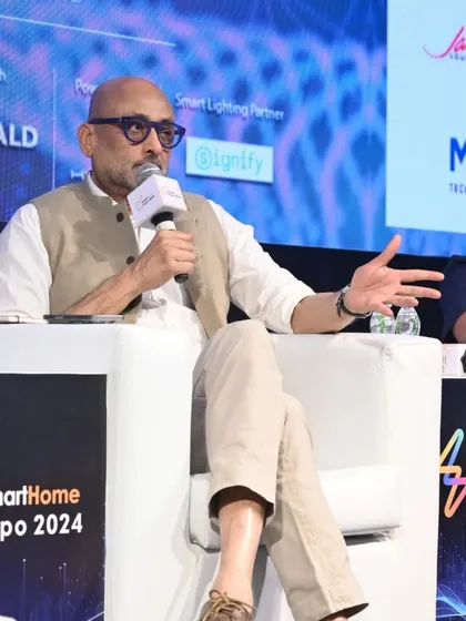 A panelist makes a point during a discussion on the future of smart lighting, highlighting the interactive nature of our sessions.