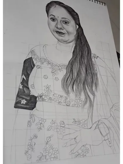 A work-in-progress image of the lehenga sketch. Here, you can see the grid lines and the gradual shading of the hair and clothing.