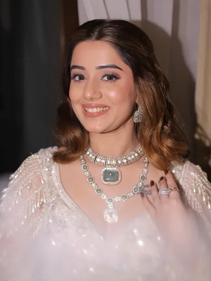 Radiant, refined, and utterly stunning. This close-up showcases the soft pink eyeshadow and glowing skin we created for this engagement look, paired with a modern, wavy hairstyle.