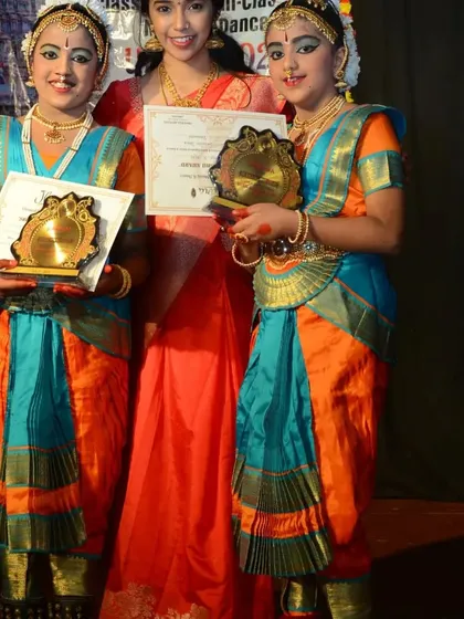 Our students Ruthvi and Dhanya proudly holding their awards at the Jhenkara festival. We celebrate every achievement of our talented dancers.