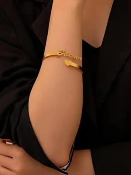 Here’s how our personalized name bracelet looks when worn. It’s a chic and subtle way to carry a special name with you.