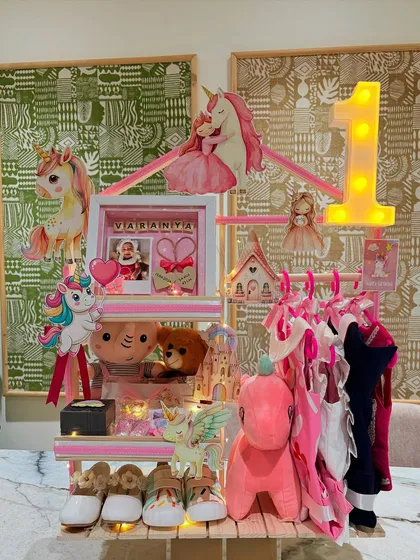 For a little princess turning one, I created this unicorn wonderland. This hamper, a special request from a loving nani, features everything from tiny frocks and booties to a personalized frame, all designed to make her first birthday a fairytale.