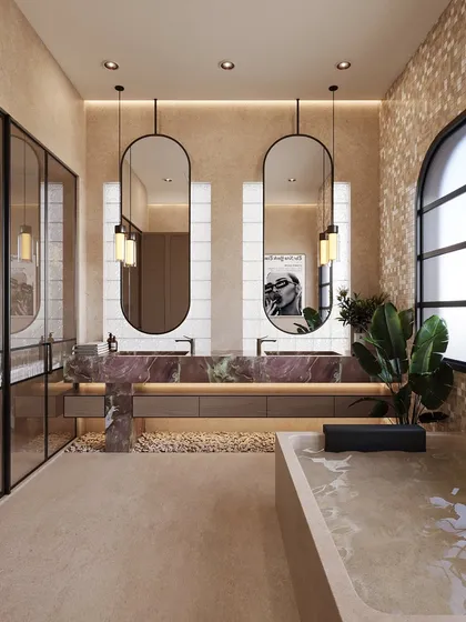 This bathroom is designed to feel like a gentle exhale. The double sink vanity is wrapped in a beautiful, dramatic pink stone, creating a focal point of soft, feminine energy. I layered textured paint on the walls and added mosaic tile accents to evoke a spa-like quality, turning this functional room into a serene retreat.