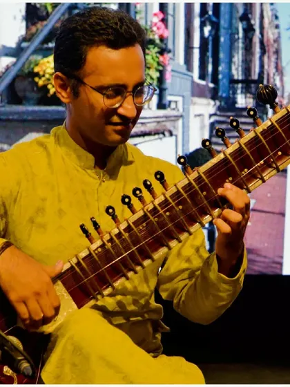 A performance with a vibrant, artistic backdrop.