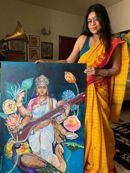For me, the best way to worship Ma Saraswati is to paint her. Here I am with my large acrylic on canvas painting of the goddess of wisdom, a piece I poured my heart into for Saraswati Puja.