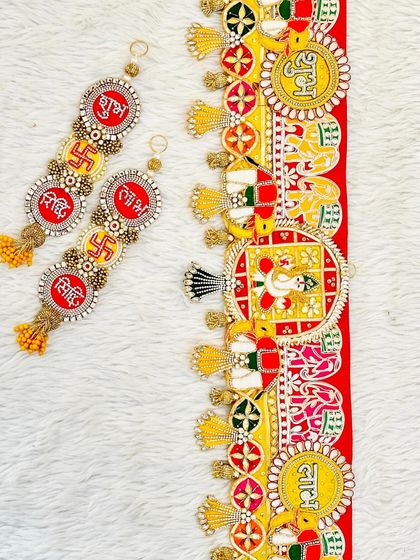 This complete door decor set features a Ganesha bandhanwar with matching Shubh, Labh, Riddhi, and Siddhi hangings, perfect for inviting blessings and prosperity.