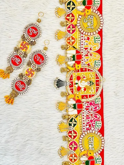 This complete door decor set features a Ganesha bandhanwar with matching Shubh, Labh, Riddhi, and Siddhi hangings, perfect for inviting blessings and prosperity.