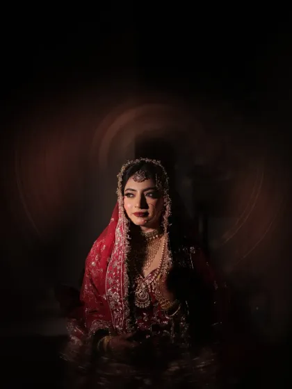 A bride's portrait is more than a picture; it's poetry. I love to play with shadow and light to create moody, artistic shots that capture the depth and grace of the moment before she walks down the aisle.