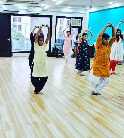 Students practicing arm movements, which are crucial for storytelling and adding grace to the dance. Every gesture is precise and meaningful.