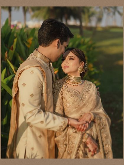 A tender moment between the couple, framed to feel like a vintage photograph. The groom holds his bride close as they share a quiet look, capturing the timeless nature of their love.