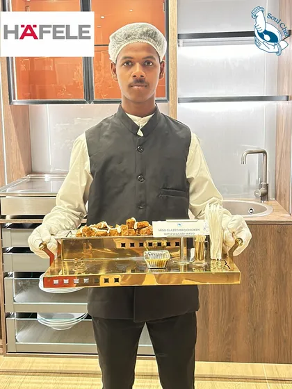Professionalism and impeccable service are at the heart of every event I cater. Here, one of my trained staff members presents appetizers at an exclusive event for Häfele, showcasing the elegant serveware and attention to detail that ensures your guests feel valued.