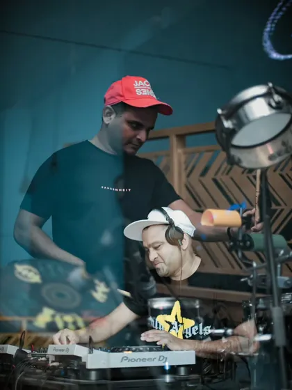 A behind the scenes look at the synergy between DJ and percussionist. Here, I'm focused on the mix while my partner gets ready to layer in the live drum beats that define our "Wakanda boys" sound.