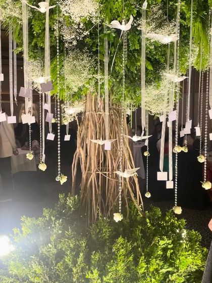 A closer look at the base of the Wish Tree, showing the intricate trunk made of woven dry twigs. This custom-built creation was a true labor of love, designed to be a symbol of the couple's growing love.