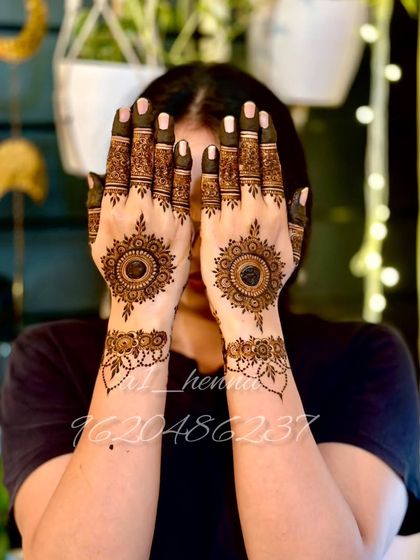 A classic Karva Chauth design featuring a central mandala, perfect for this special festival.