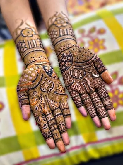 A classic Indian mehendi design with full coverage and traditional motifs.