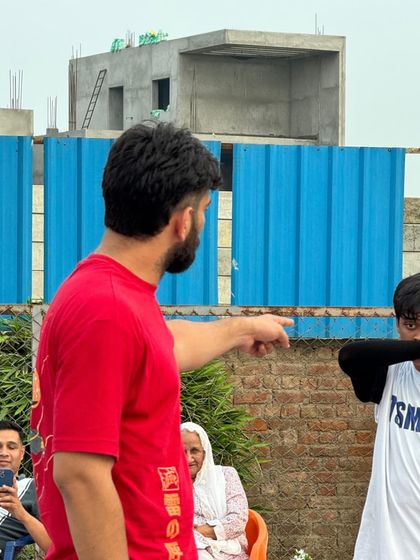 Giving tactical instructions during a timeout in the U-17 practice match against INSFIRE. Coaching is about strategy, not just drills.
