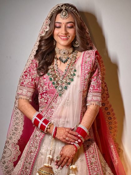 A beautiful portrait of the bride. The minimal makeup and soft waves create a look that is both modern and timeless.