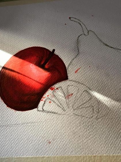 There's nothing like morning sunlight hitting a work in progress. This photo captures that beautiful moment, highlighting the rich red of the apple I was painting.