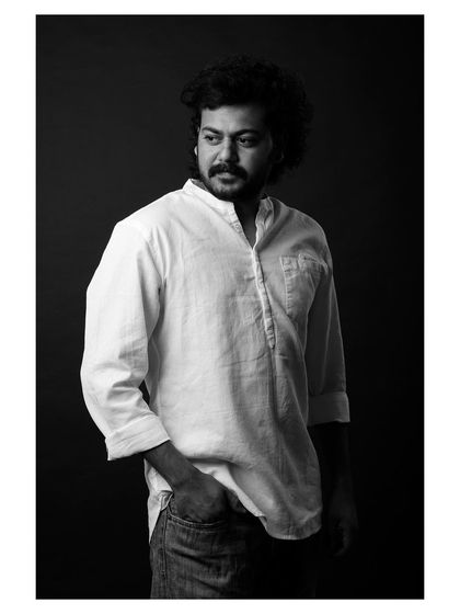 A strong and character-driven black and white portrait of an actor. The lighting is dramatic, highlighting his features and creating a compelling headshot.