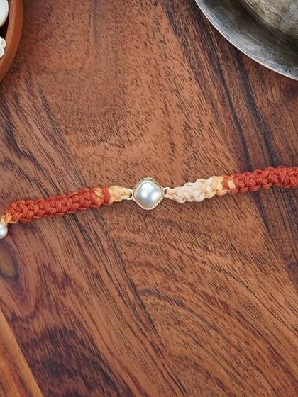 A flat-lay of the Kundan Rakhi. It's an elegant and understated option for your brother.