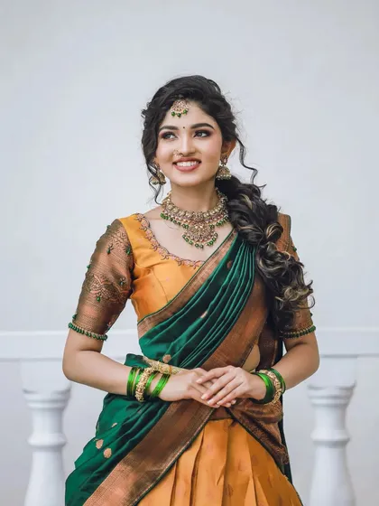 This is my modern take on the traditional half-saree, a beautiful Langa Voni. The combination of mustard yellow and emerald green silk is perfect for festive occasions or a bridesmaid's outfit, blending tradition with a fresh, contemporary style.