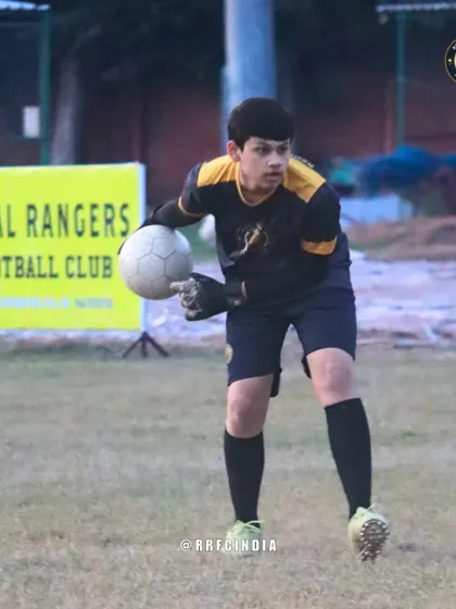 Our goalkeeper in action, focused and ready to make a save. We provide specialized goalkeeper training to develop the unique skills required for this critical position.