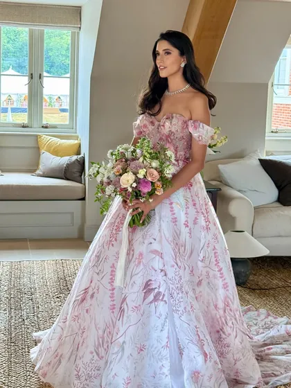 A full view of this fairytale bride. Her soft, natural makeup was designed to complement the romantic feel of her Hermione de Paula gown and the beautiful UK setting.