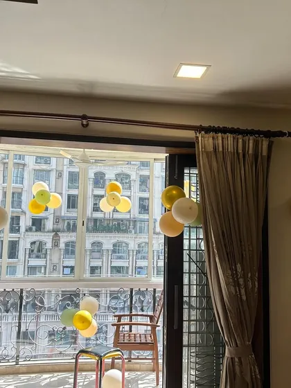 We filled the home with balloon clusters in a gentle, safari-inspired color palette to create a festive atmosphere.