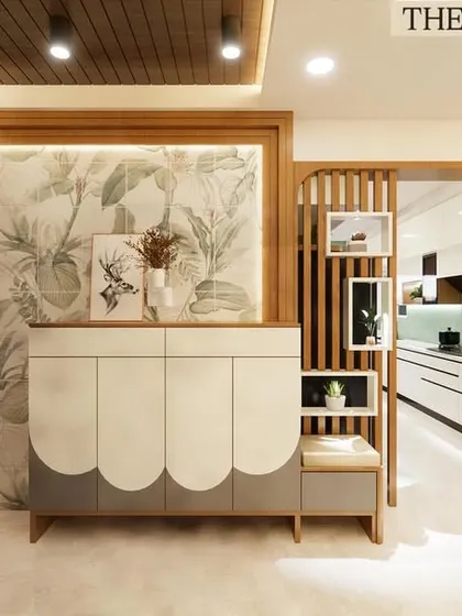 This foyer design required careful coordination. We executed the installation of the wooden slat partition, the custom-designed scalloped console, and the botanical wallpaper, ensuring all three distinct elements align perfectly.