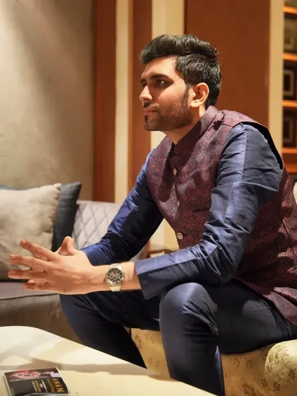 In conversation, discussing the final details before the show. Even in candid moments, the focus is on perfection.