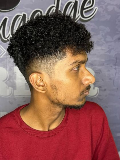 Another view of this curly haircut, showing the clean lines and great texture.