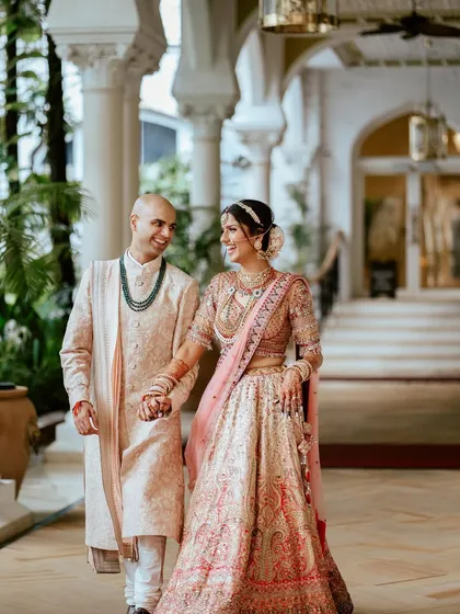Aachal and Chinmay taking a stroll, hand in hand, after their wedding. A quiet moment of togetherness amidst the grand celebration.