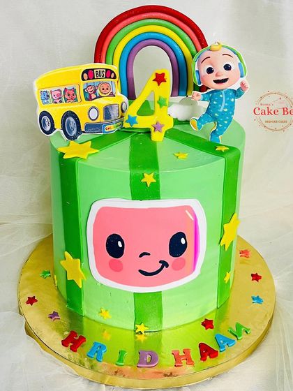 A full view of the green striped Cocomelon cake.