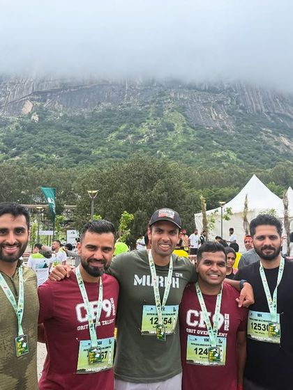 The guys from the team posing with our medals against a stunning mountain backdrop. These events are tough, but we always finish stronger together.