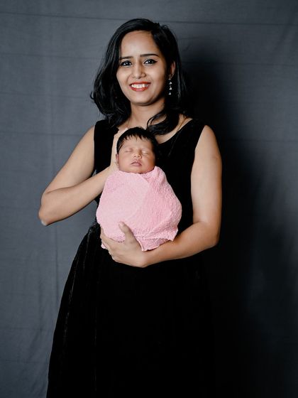 A mother holding her precious newborn. These simple, elegant portraits are timeless.