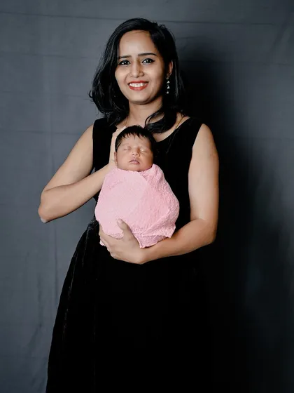 A mother holding her precious newborn. These simple, elegant portraits are timeless.