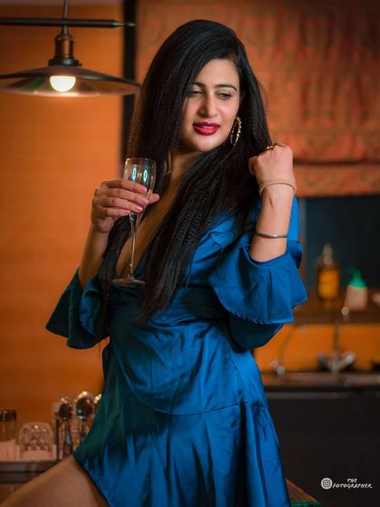 A glamorous indoor shot with a party vibe. I used the location's lighting to create a sophisticated and celebratory mood.