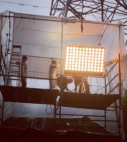 Here, our team sets up a 96 bank 'Half Wendy' light on an 8x8 foot tower. This beast of a conventional fixture provides a massive wall of light and requires specialized rigging and large format 8x8 foot color temperature blue frames.