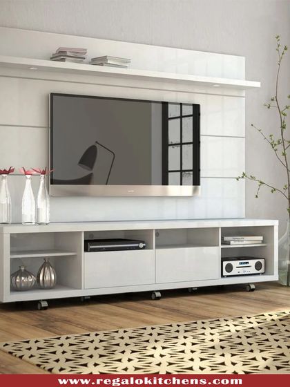 A clean and simple white TV unit on casters, offering flexibility and mobility. The open and closed storage compartments are perfect for organizing media devices.