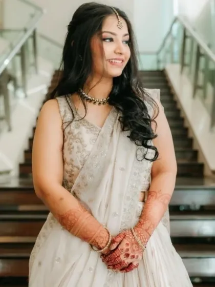 Fresh and radiant for the bride's sister. This soft glam look enhances her natural features, giving her a timeless glow that's perfect for wedding photos.