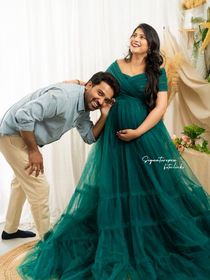 A playful moment where the dad-to-be listens to the baby bump, full of fun and excitement.