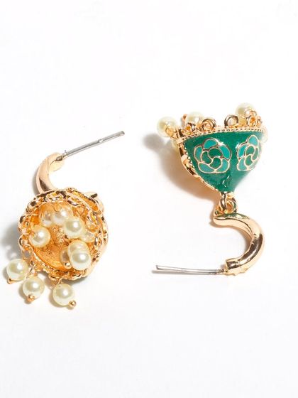 These green enamel jhumkis don't just hang, they sing. They are designed to be lightweight and to oscillate beautifully, with delicate pearls that add to their charm. More colors are available.