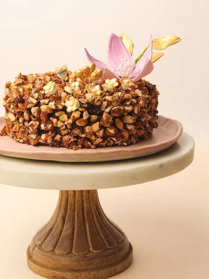 My Almond Nougat Chocolate Cake is all about texture. The crunchy almond nougat coating provides the perfect contrast to the rich, moist chocolate cake inside.