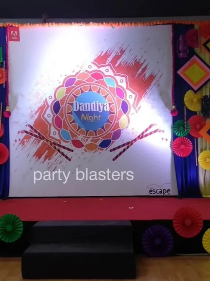 We create vibrant, culturally rich environments for themed corporate parties like this Dandiya night. The stage backdrop incorporates traditional motifs, bright colors, and dynamic lighting to capture the festive spirit of the celebration.
