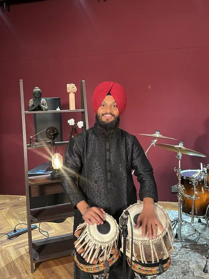 Ready for a music video shoot in a Mumbai studio. I am comfortable in front of the camera and enjoy the process of bringing music to life visually. Whether it's a classical piece or a fusion track, I bring my best tablas and my full dedication to the set.