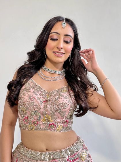 A playful and happy shot of the client, her makeup looking fresh and radiant.