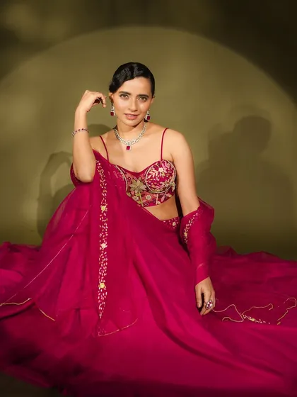 This shot captures the flow and movement of the silk lehenga, with the makeup remaining perfectly in place under the studio lights.