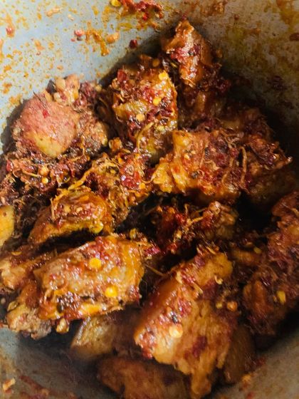 A close up of my pork with dried bamboo shoot. You can see the texture from the shredded bamboo and the spice from the king chilli flakes.