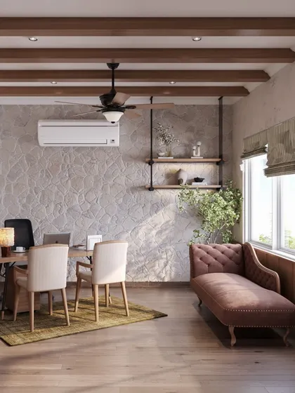 This home office is a calm corner designed for focus. A standout stone feature wall adds grounding texture, while a plush chaise lounge by the window offers a comfortable spot for breaks. The design blends rustic warmth with clean, modern function.