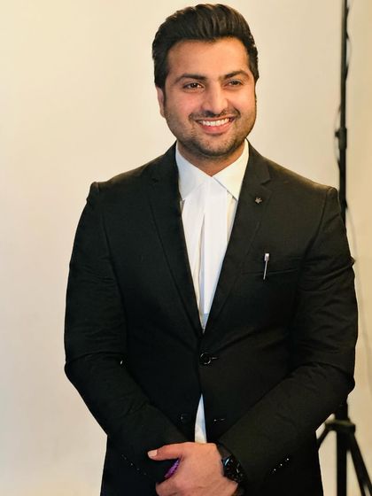 A professional photo where I believe a smile shows confidence and approachability.